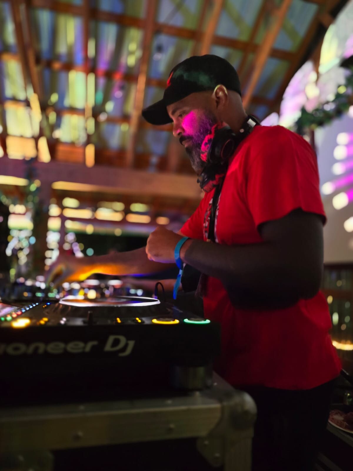 JT.dnb performing under festival tent lighting