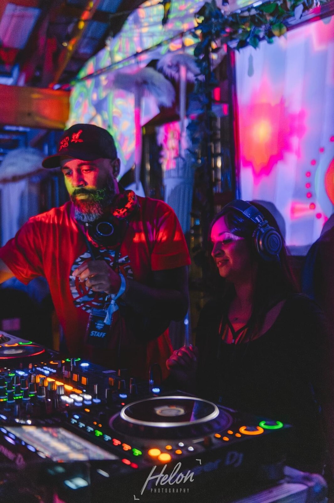 JT.dnb playing a set at a colorful indoor venue