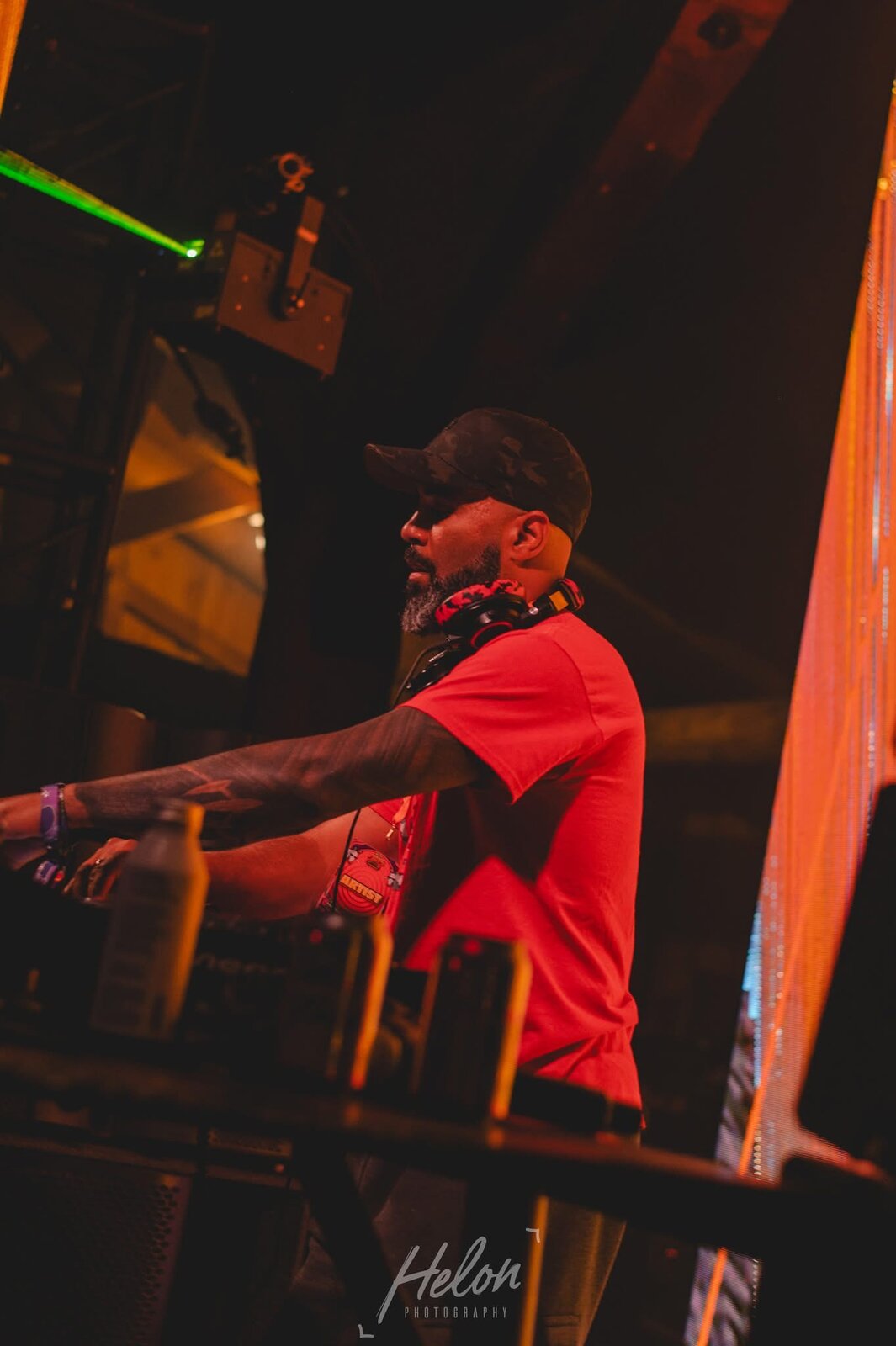 JT.dnb performing in profile under stage lighting